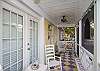 The front screened porch features rocking chairs and a view of 7th Street.
Plenty of rocking chairs for the front screened porch! Perfect for people watching the beach strollers or bicyclist or enjoying the peacefulness of the quiet street.