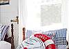 This nautical themed bedroom has three full size twin beds. Ideal for a family or for a girls' weekend. (Book club anyone?)