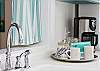 Kitchen sink area featuring our Mermaid Morning Bliss coffee.  All of our cottages feature our organic coffee; you can purchase this coffee at Seaside Sisters gift shop on Tybee and proceeds support sea turtle preservation!