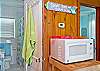 Kitchen microwave; this shot also shows bathroom behind kitchen.