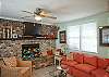 This area is a combination living space- family room with large flat screen TV, lots of seating, small step up to dining room area and leads to the kitchen as well.