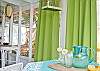 Our screened porch continues to get better and better. Lime green outdoor curtains, lots of seating- even "Phil" a vintage pink refrigerator from the 1950's Mary Kay restored. Ready to hold all those beachy themed beverages!