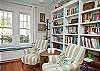 Entry area of living room; Mary Kay Andrews' books as well as lots and lots of other reading material.