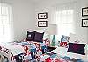 Our cheerful bedroom! Red, white and nautical blue!  One double and one twin bed.