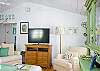 The living room features a HD TV with DVD/CD player and I-Pod stereo dock.