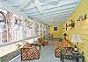 The screened porch has lots of seating as well as a large farm style table and chairs to enjoy meals or playing games.