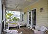 The sleeping porch is off the master bedroom on the 2nd floor. The porch is screened in and surrounded by large live oaks.
