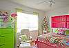 Downstairs bedroom #1. Queen bed and lots of fun pink and lime green!