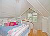 The stairs lead to the 2nd floor which is one very large room with nooks.  There is a double bed and a queen bed upstairs.  There is also a sitting room with cable tv and the 2nd floor bathroom