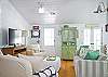 The living room has lots of comfy seating to relax and enjoy!