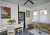 This is the former screened porch that has been fully-enclosed and is now a separate sitting and dining area.