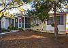 Welcome to Basking Under the Tybee Sun!  
The front porch has a wonderful view of the oaks and the bike riders who frequent 7th and 2nd Avenues.