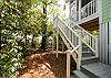 Door and staircase outside from the enclosed porch off of ktichen.