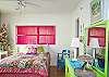 Downstairs bedroom #1. Queen bed and lots of fun pink and lime green!