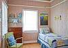 Half-bedroom with twin bed.