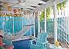 Views of the screened porch on rear of cottage.  Fun, bright and colorful!