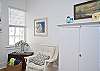 This large light filled room includes a sofa, chairs, dining room table and Cable tv.  Full of wonderful nautical details