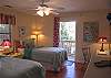 Bedroom with twin beds with access to the 2nd floor deck.
