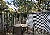 The back yard and garden features two seperate seating areas with large unbrellas. The yard is not fenced in, however there's plenty of area to play and relax.
