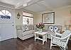 The first floor living room area is a combination of the living room with sofa and cable TV, dining room area with table that seats 6 people.