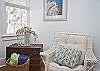 This large light filled room includes a sofa, chairs, dining room table and Cable tv.  Full of wonderful nautical details