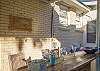 Backyard bar adjacent to pool and backyard seating area.