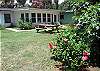 View of backyard and picnic table.