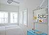 The queen bed headboard is a piece of vintage iron fencing.