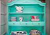 Great aqua china cabinet; this cottage is full of fun color!