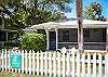 Another view of exterior of Sea Largo Cottage. Sea Largo is a ground level cottage ideal for families or older people . Large fenced in yard surrounds the cottage.