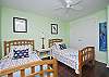 We have two bedrooms on the first floor. This is the bedroom with the 2 twin beds.