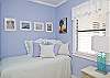 The twin bed with the owner's photographs of Tybee