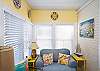 Sunroom; bright and sunny with large windows.