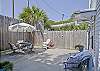 Our fully enclosed backyard/ courtyard features the outdoor seating and some terrific local outdoor art ( note the fish made from a surfboard!) We have a gas grill and a beach cart for you to use.
