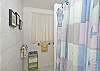 The cottage features two full bathrooms. They each have a shower.