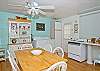 Kitchen area. The main room of the cottage is one big family room. Big open kitchen, dining room tables and family area. Bright and cheerful, freshly renovated.