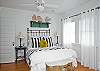 The master bedroom includes the queen bed, master bedroom, sitting area and also acess to screened porch.