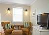 One large room with lots of purposes!  Hardwood floors and lots of natural light