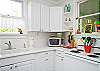 Another view of this bright, roomy beach cottage kitchen!
