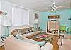 The delightfully bright, open living space includes kitchen and dining areas along with comfy furniture, flat screen TV, dvd player, cable TV service and complimentary WiFi.