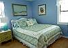 The pale blue bedroom is so cool and relaxing.  The photograhers in the room are from scenes of Tybee