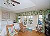 This is the king master bedroom with a master bath. It opens onto the the top floor deck overlooking the marsh.