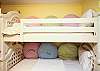 The Bunk Room features 1 set of bunk beds with a twin trundle below, sleeps 3. Great space for kids! This bedroom, like all the bedrooms features a flat screen TV and DVD player.