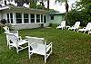 Our back yard ( door leads out from the sun room) has lots of play area for kids and dogs and seating. We also have a charcoal grill.  We have 2 large, mature fig tress in the backyard which will provide fresh fruit all summer long for your enjoyment!