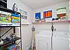 Big, bright laundry room with storage for games for all ages!