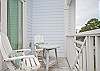 Balcony seating area off of master bedroom.