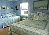 The pale blue bedroom is so cool and relaxing. The photograhers in the room are from scenes of Tybee