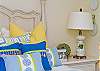 Details of second bedroom upstairs with queen bed.