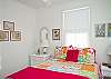 Master bedroom with private bath features a queen bed (another view).