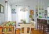 The dining room area also leads out to the screened porch. The table seats 6 and the kitchen bar counter seats another 3.